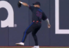 Blue Jays’ Lukes fires a throw to get Rangers’ Carter out at second