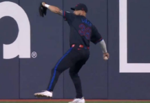Blue Jays’ Lukes fires a throw to get Rangers’ Carter out at second