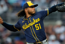 Peralta earns MLB-best 15th win as Brewers blank Cubs