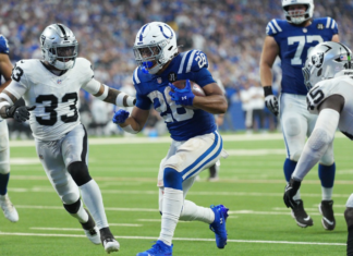 Taylor runs for three TDs, Jones throws for two as Colts rout Raiders